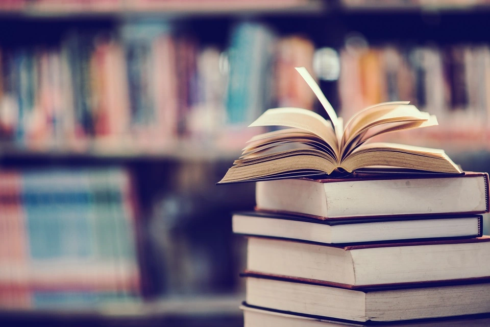 A pile of books in a library.